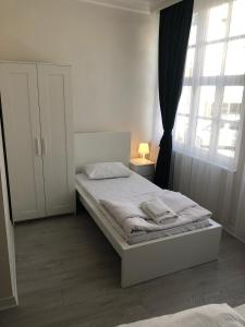 A bed or beds in a room at ATICI HOTEL