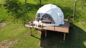 an overhead view of a tent on a wooden deck at Nomad Glamping in Šipovo