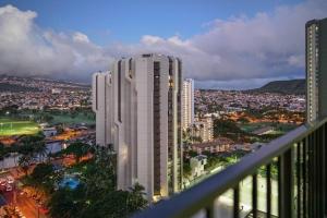 a view of a city with a tall white building at The Whale Suite @Waikiki Banyan (1 Free Parking) in Honolulu