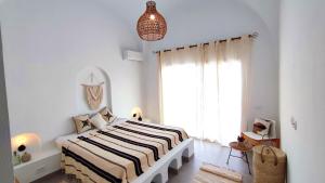 Uma cama ou camas num quarto em Villa Pupputia Hammamet M'rezga beach