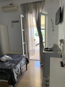 Postel nebo postele na pokoji v ubytování Guesthouse Corali