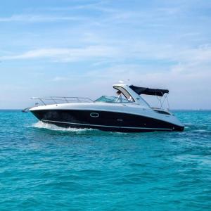 a black and white boat in the water at Yacht Cancun Rent & Tours in Cancún