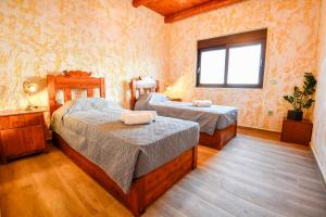 a bedroom with two beds and a window at VILLA DEMETRA in Kissamos +37 photos