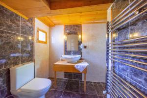 a bathroom with a white toilet and a sink at Şerbetçi Garden Konak in Safranbolu