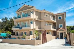 a large apartment building on a street at Egialion Iqia in Argostoli