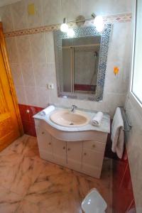a bathroom with a sink and a mirror at Great villa, Sea views, 20 secs walk to the beach, BBQ, 9 people, 5 mins car from Alicante city center, sailing club 3 mins walk in Alicante