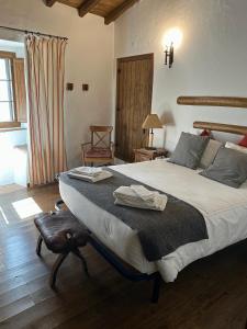 a bedroom with a large bed in a room at Maruan Heaven in Marvão