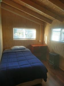 Postel nebo postele na pokoji v ubytování Hospedaje Martita Patagonia