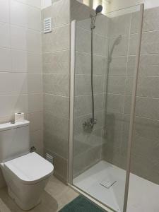 a bathroom with a shower with a toilet at Marimar in Praia