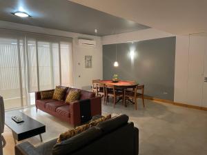a living room with a couch and a table at Marimar in Praia