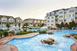 a pool at a resort with a water fountain at 1B/1B condo with Ocean views, Resort style, Free WIFI, Few steps to the Beach!! in Wildwood Crest