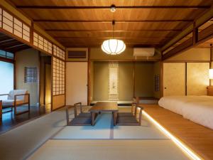 Krevet ili kreveti u jedinici u okviru objekta Ryokan Onomichi Nishiyama