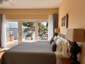 a bedroom with a bed with a view of the ocean at Waterway in Charleston