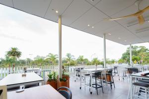 an empty restaurant with tables and chairs at Hotel Renmark in Renmark