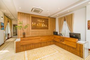 a lobby with a reception desk in a building at Hawal Boutique Villa Hoi An in Hoi An