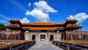 a large building with a blue sky in the background at Casablanca Hotel in Hue