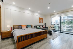 Un ou plusieurs lits dans un hébergement de l'établissement Dcapitale Studio apartment in Cau Giay