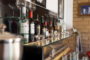 a bunch of bottles of wine on a bar at ArcoSodi Hotel Boutique in Oaxaca City