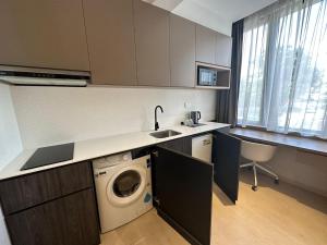 Kuchyň nebo kuchyňský kout v ubytování ISA Hotel Amber Road