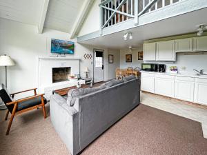 a living room with a couch and a fireplace at Tidal House 2 in Ocean Shores