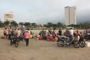 a group of people standing around a group of motorcycles at Hiên lương hotel &Apartment in Danang