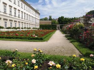 a garden of flowers in front of a building at Good times @ Salzburg in Habach