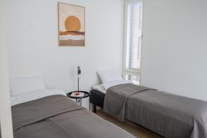מיטה או מיטות בחדר ב-Snowflake suites VIII with private sauna
