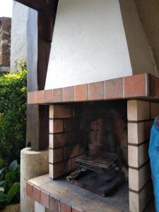 a brick oven with a grill inside of it at Gite de la Sauvetat in Auvillar