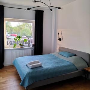 Posteľ alebo postele v izbe v ubytovaní Apartament Słoneczny 2