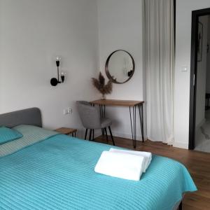 Posteľ alebo postele v izbe v ubytovaní Apartament Słoneczny 2