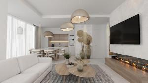 ein Wohnzimmer mit einer weißen Couch und einem Kamin in der Unterkunft club arona by laren hotels in Serik