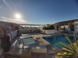 a swimming pool with a view of the ocean at Antonios 1 in Matala
