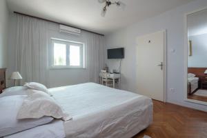 Posteľ alebo postele v izbe v ubytovaní Apartment A Kind of Magic + 17 fotografií