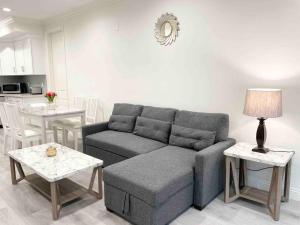 a living room with a couch and a table at Charming 3B3B Townhome (Relax & Family Friendly) in Pasadena