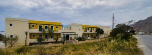 a row of houses on the side of a road at Dilina Studios in Arkasa