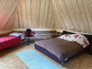 Kakulaane Tourism Farm tesisinde bir odada yatak veya yataklar