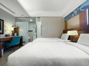 Postel nebo postele na pokoji v ubytování Guide Hotel Taipei NTU + 21 fotografií