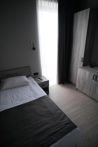 Postel nebo postele na pokoji v ubytování Vip Avtim hotel