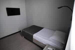 Postel nebo postele na pokoji v ubytování Vip Avtim hotel