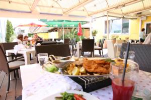 a tray of food on a table in a restaurant at Hotel Reinisch in Köflach