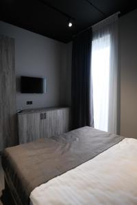 Postel nebo postele na pokoji v ubytování Vip Avtim hotel