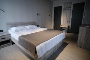 Postel nebo postele na pokoji v ubytování Vip Avtim hotel