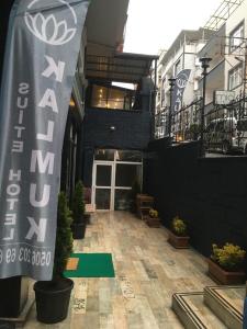 a building with a sign in the middle of a courtyard at KALMUK SUIT in Trabzon