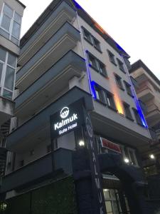 a building with a kushimaundai sign in front of it at KALMUK SUIT in Trabzon