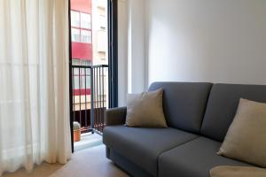 Alidreams Lola Center Apartamentos的休息区