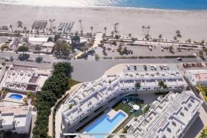 an aerial view of a resort near the beach at Magnífico apartamento nuevo en 1ª línea de playa in Mojácar