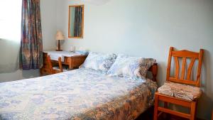 Postel nebo postele na pokoji v ubytování Kusini House & Campsite
