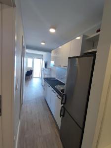Kuchyň nebo kuchyňský kout v ubytování Apartments Ivančić