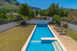 a swimming pool in the backyard of a house at Casa Mut in Artá