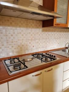 a kitchen with a stove top oven in a kitchen at A casa di nonna Elvira in Vietri sul Mare